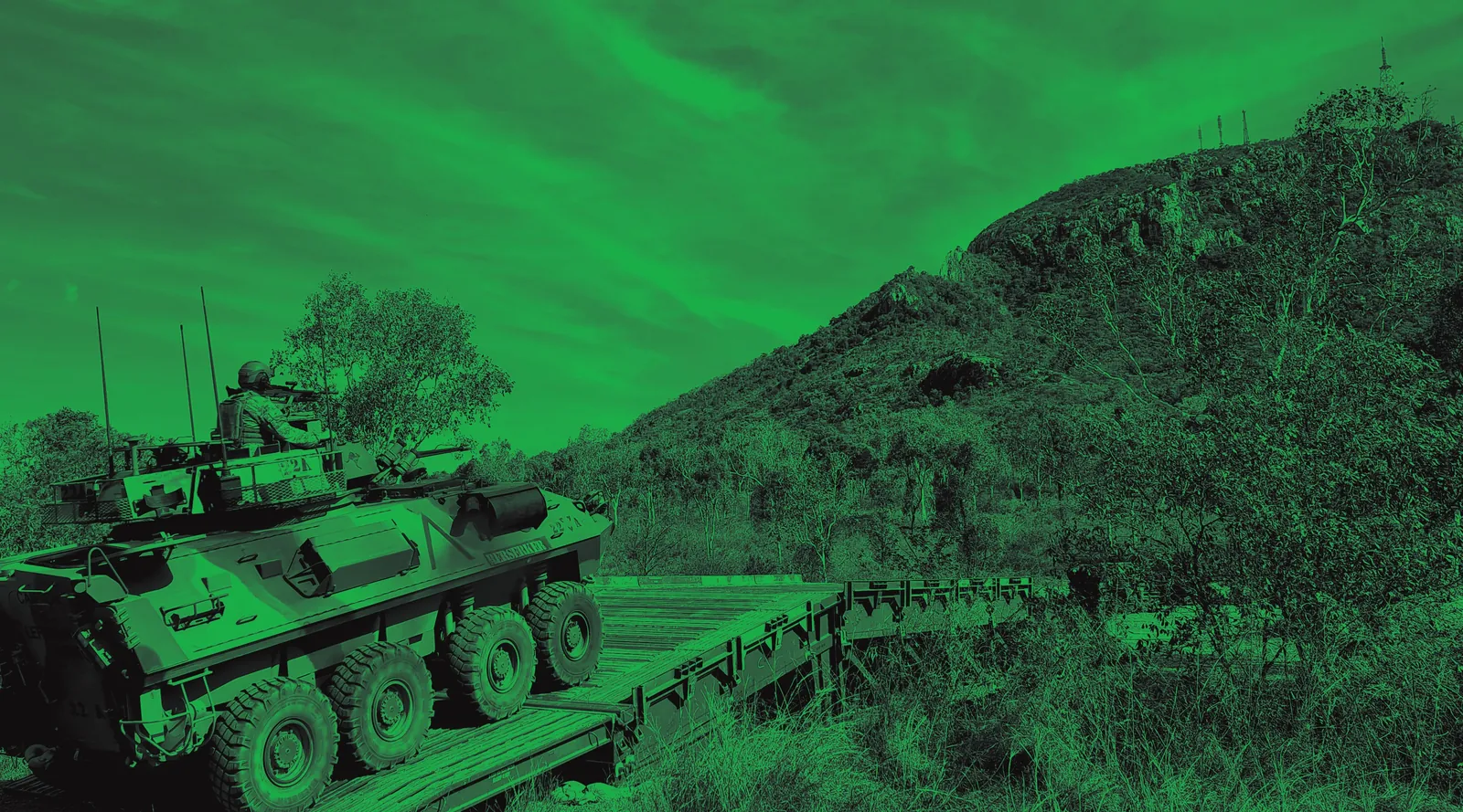 Armoured vehicle crossing rugged terrain on approach to a gap crossing